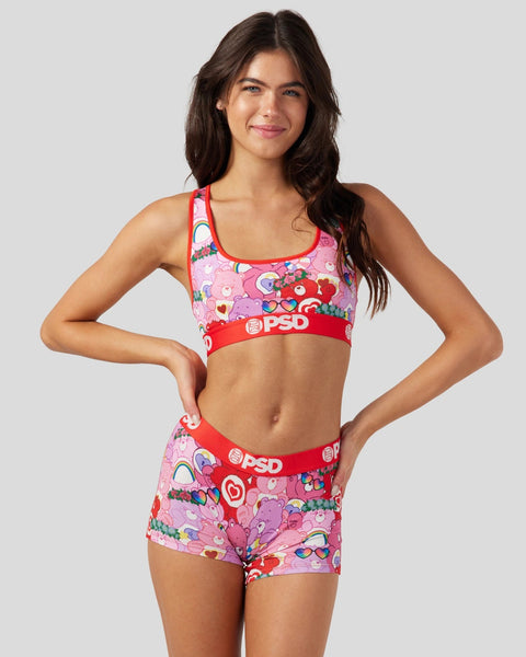 Pink Care Bears sports bra and shorts set with red trim and PSD branding.