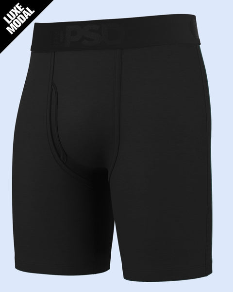 Black modal boxer briefs with elastic waistband and contrast stitching detail on light blue background.