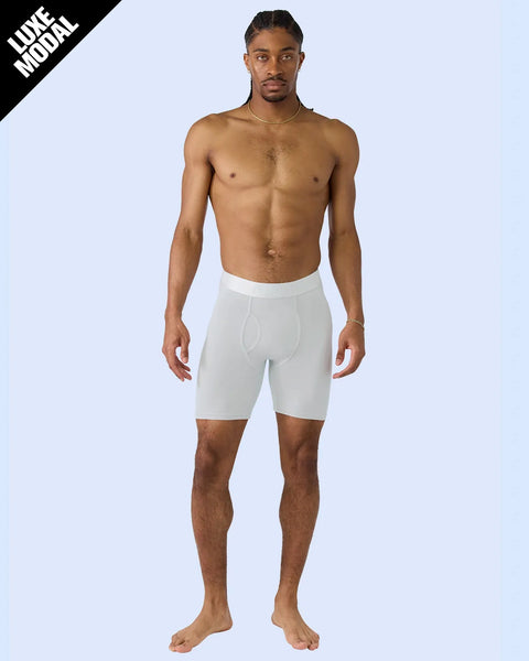 Man wearing white modal boxer briefs with elastic waistband and fly detail.