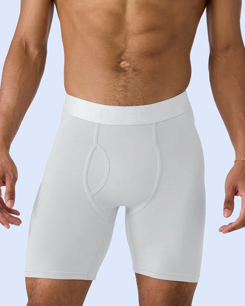 White modal boxer briefs with elastic waistband and contoured pouch on male model against light blue background.