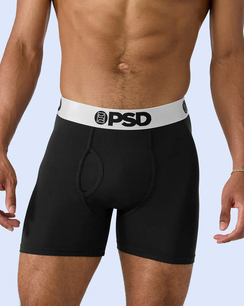 Black boxer briefs with white waistband and PSD logo, shown on male model against light blue background.