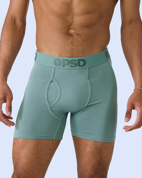 Sage green modal boxer briefs with PSD waistband and contoured front pouch on model.