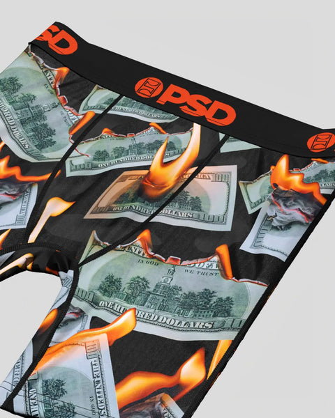 Black underwear with orange PSD waistband featuring dollar bills and flame graphics throughout.
