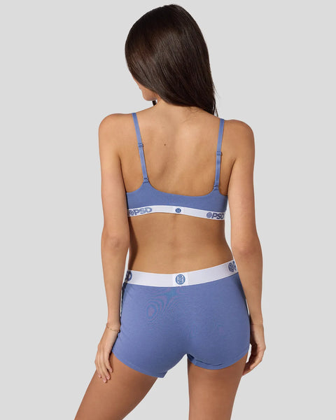 Blue denim modal bra and shorts set with white waistband trim and logo details, shown on model from back view.