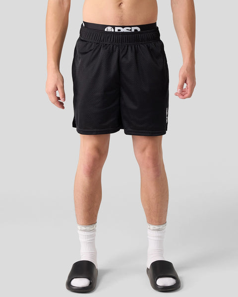 Black active shorts with elastic waistband and mesh texture, shown on male model with white socks.