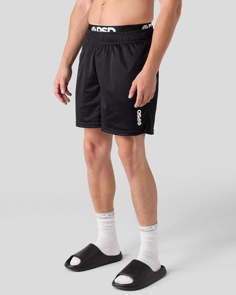 Black mesh active shorts with elasticized waistband and brand logo on leg.