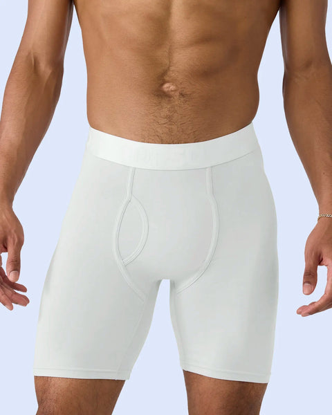 White modal boxer briefs with fitted waistband and contoured pouch on male model against light blue background.