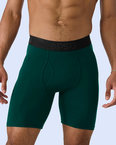 Deep green modal boxer briefs with black textured waistband, shown on male model from waist to mid-thigh.
