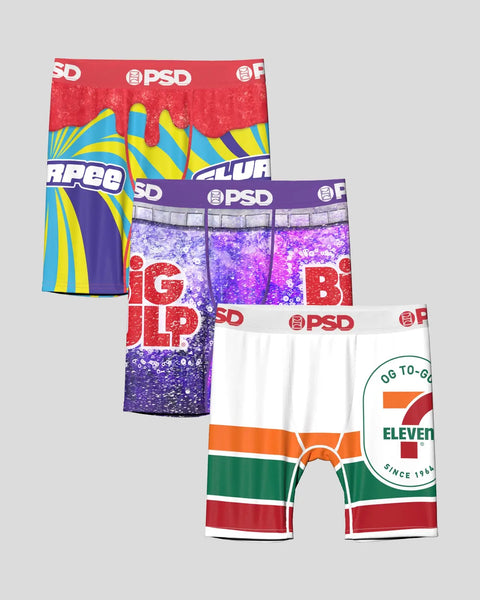 Three PSD branded boxer briefs: red and blue striped pair, purple sequined pair, and white pair with 7-Eleven logo and green,